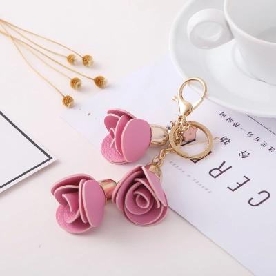 China Advertising Leather Camellia Flower Keychain Bag Pendant Car Keyring For Women Bag for sale