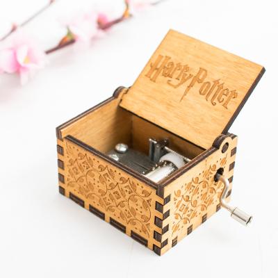 China Custom OEM New Arrival Mini Hand Crank Laser Engraved Wood Crank Music Box for sale