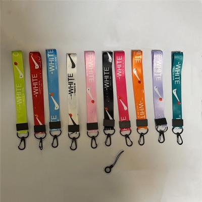 China Daily wholesale pink phone case earhone belt sublimation strap accessories key designer short chain lanyards with logo custom for sale