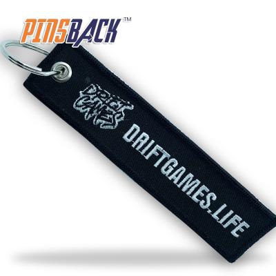 China custom embroidered keychains 3D double sided custom twill fabric logo tag patch with keychain embroidery keychain design for sale