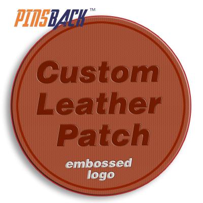 China custom embossed 3D leather patch logo for fashion material design apparel PU leather patch logo custom sew on backing patch for sale