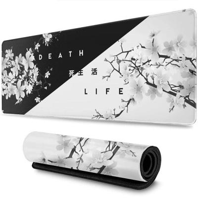 China Large Black And White Waterproof Customized Non-Toxic Cherry Blossom Gaming Rubber Mouse Pad for sale