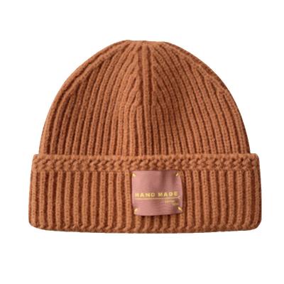 China COMMON winter hat men's and women's universal label leather logo warm custom knitted hat for sale