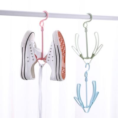 China Punch-free Multifunctional Windproof Balcony Drying Rack Shoe Scarf Clothes Daily Necessities Hanger Baby Cloth Hanger Wire Hanger for sale