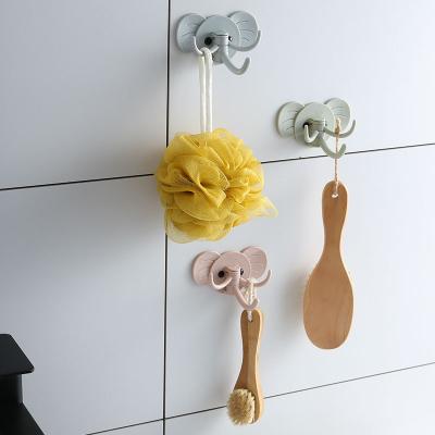 China Creative Multi-Functional Cable Punch-free Creative Hanging Hanger Shelf Storage Bedside Wall Mobile Phone Holder Fixed Hanger for sale