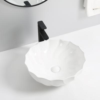 China Wholesale Modern Bathroom Sinks Nordic Single Hole Ceramic Bathroom Sinks Solid Hand Style Outdoor Basin for sale