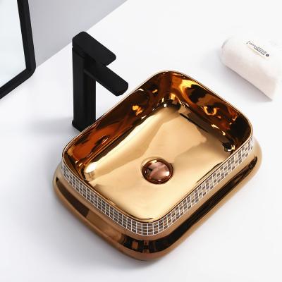 China Wholesale Clean Easy Clean Sinks Elegant Gold Ceramic Bathroom Countertop Hotel Basin Sink Single Basin Bathroom Sink for sale