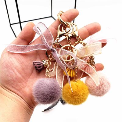 China Wholesale Fashion Cute Bow Lace Fur Ball Bag Plush Pendant Cartoon Car Key Chain Gift Key Chain Accessories Small for sale