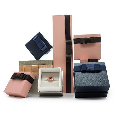 China Custom high end luxury custom logo bowknot ribbon bowknot sky and earth cover valentines gift necklace ring siding luxury jewelry box packaging for sale