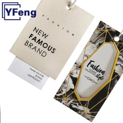 China Other Luxury Custom LOGO Emboss Printing Clothing Garment Gift Wrapping Craft Paper Cardboard Swing Hangtag With String for sale