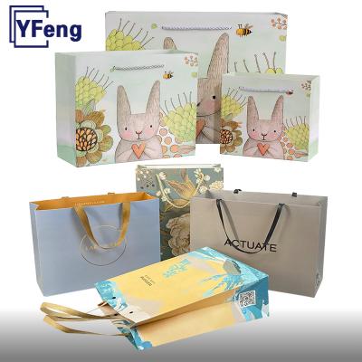 China Recycled Materials Best Price Emboss Hot Stamping Deboss Print Clean Logo Food Gift Box Wrapping White Cardboard Kraft Paper Bag With Handle for sale