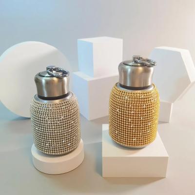 China Creative PORTABLE 300ml Gem Colored Luxury Stainless Steel Diamond Insulated Rhinestone Water Bottle Bling Tumbler for sale