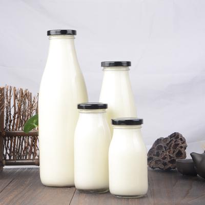 China Wholesale 200ml 250ml 500ml Beverage Empty Clear Glass Milk Bottle Drinking Glass Bottle Beverage Bottle With Caps for sale