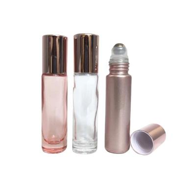 China Recyclable Essential Oil Bottle 5ml 10ml Pink Roll On Roller Glass Bottle With Crystal Gemstone Roller Ball And Rose Gold Cap for sale