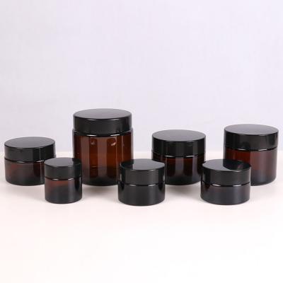 China Small Amber Cosmetic Cream Container Glass Jar Customized Wholesale Eco Cosmetic 5g 10g 15g 20g 30g 50ml 100g With Black Round Lid for sale