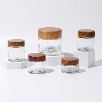 China Hot Selling Cosmetic Face Cream Container 40ml 80ml 90ml 110ml Frosted Clear Glass Jar With Bamboo Wooden Lid for sale