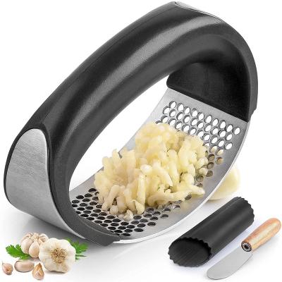 China Sustainable Premium Stainless Steel Garlic Meat Grinder with Silicone Peeler and Scraper Curve Shape Design Garlic Crusher with Comfortable Handle for sale