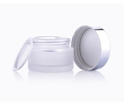 China Fashionable factory direct sales empty face cream containers 20g 30g 50g clear black glass round lid cosmetic cream jar for sale