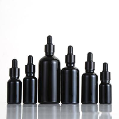 China Recyclable Custom Logo Black Cosmetic Oil Dropper Bottle 5ml 10ml 15ml 20ml 30ml 50ml 100ml Essential Oil Glass Bottle for sale