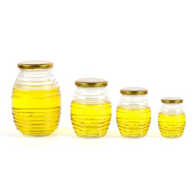 China Hot Selling Hive Personal Care Honey Container Honey Glass Jar Oval For Honey for sale