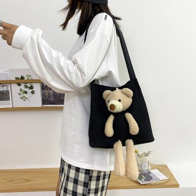 China High quality new design central institute of statistics bear canvas bag student shoulder bag large capacity female cute canvas bag for sale