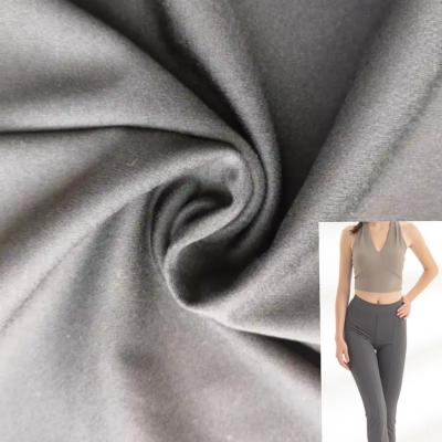 China Stretch promotion stocklot snap 24 nylon spandex 76 fabrics for yoga wear fabric and gaiters fabric in black color for sale