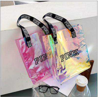 China Custom Pink Handled Holographic PVC Shopping Tote Bag Transparent Beach Bag With Handle for sale