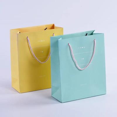 China Recyclable Shopping Paper Bag With Handle Custom Printed Paper Packaging Bag Gift Tote Bag for sale