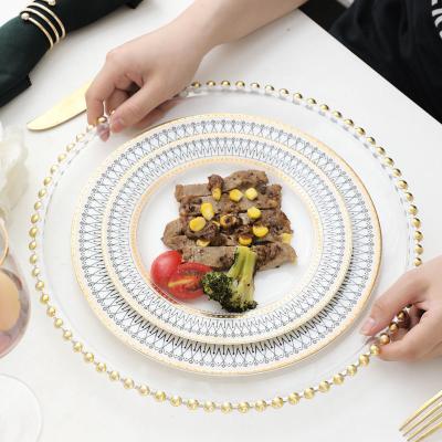 China Sustainable High End Product Decal Printing Round Luxury Ceramic Dinner Charger Plates Wedding With Logo for sale