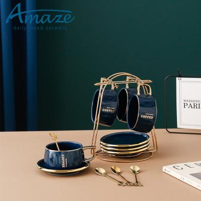 China Wholesale Viable Luxury Gold Rim Shiny Blue Porcelain Modern Coffee Tea Cups And Saucers With Metal Stand for sale