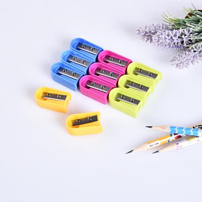 China Custom Round Mini Stationery School Black Plastic Pencil Sharpener for sale