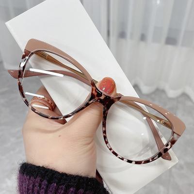 China Cat Eye TR90 metal spring leg flat mirror cat eye glasses retro frames 2022 new contrast color glass anti-blue light beauty for sale