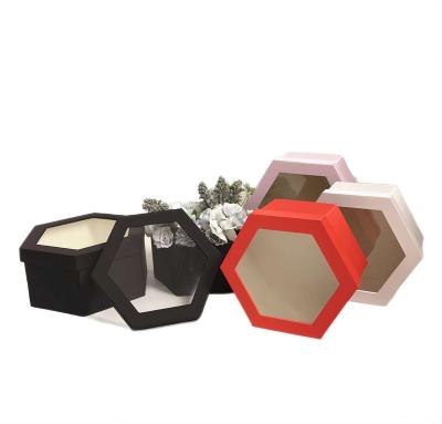 China Recycled Materials Custom Spots Tined Cloth Hexagonal Solid Color Paper Box Black Gift Boxes for sale