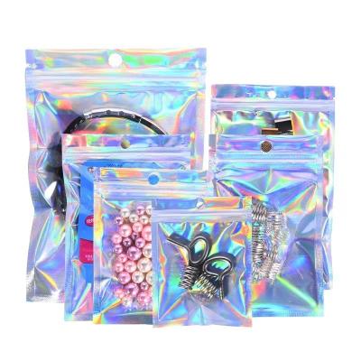 China Moisture Proof Holographic Smell Proof Bags Edible Food Resealable Foil Zipper Pouches Food Storage Holographic Mylar Bags with Clear Window for sale