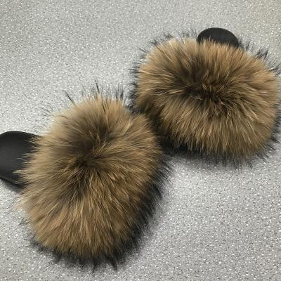 China Fashion Trend Big Raccoon Fur Slippers Luxury Fluffy Slipper Real Fur High Quality Furry Slides For Women for sale