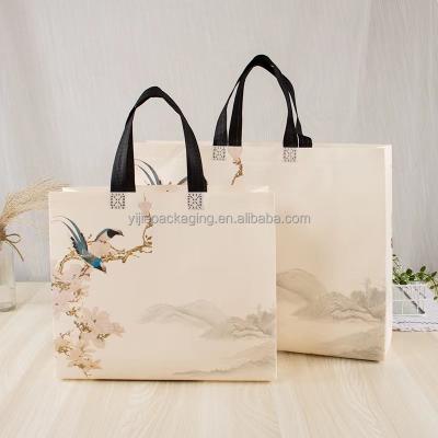 China Art Paper Recyclable Cardboard Handbags Garment Bag Recyclable Packaging Women's Custom White Shopping Handbag for sale