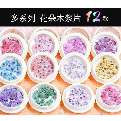 China Wood 12 colors nail color small INS leaf wood pulp flower wrap the same paragraph simulation flower nail decoration patch for sale