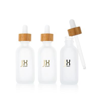 China Frosted Glass Medicine Dropper Bottle Kid Safe Container 60ml Custom Logo Essential Oil Bottle With Bamboo Dropper Cap for sale