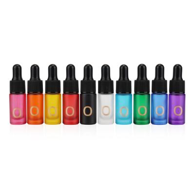 China New Style Cosmetic Colored Glass Perfume Oil Bottle Essential Oil Glass Bottle Serum With Dropper for sale