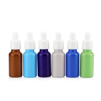 China Round Face Serum Dropper Cosmetic Bottle Amber Blue Green Colored Glass Bottle Cosmetic Essential Oil Bottle for sale