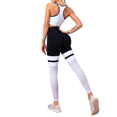 China Breathable Mesh Yoga Suits Sport Fitness Product Black Warm White Stitching Yoga Set for sale