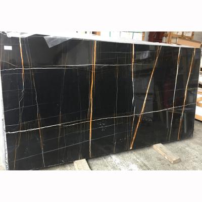 China Modern Black Golden And White Veins Sahara Noir Marble Slabs With Polished Wholesale Tunisia Marble Tiles for sale