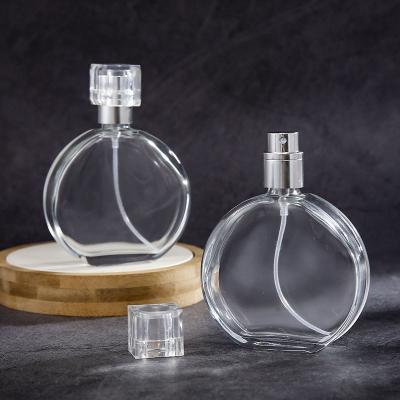 China 20ml 50ml 100ml Cosmetic Empty White Luxury Beautiful Round Shape Luxury Glass Perfume Bottles for sale