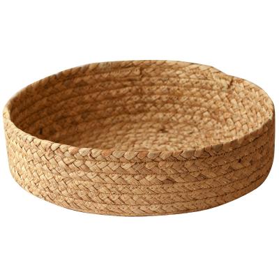 China Round Top Quality Straw Hyacinth Water Storage Basket Eco-Friendly Sustainable Rattan Container For Whetstone Decoration for sale