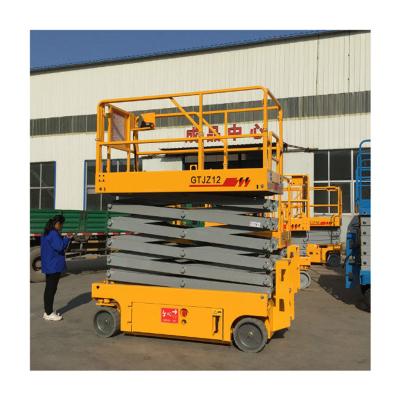 China Hotels 12m Hydraulic Mobile Self Propelled Lift Platform Electric Scissor Man Lifts for sale