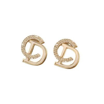 China Fashion A97 Simple Assorted Sense 2023 Cute Light Luxury Women Dropshipping Luster Diamond CD Letter Stud Earrings Full Tops New for sale