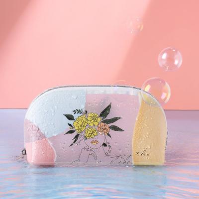 China Cute Fashion TPU Cartoon Girl Printing Semicircle Cosmetic Transparent Cosmetic Bag Storage Ins Cosmetic Bag for sale