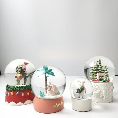 China Good Price Cute Custom Resin Glass Christmas Gift Snow Globe With Blowing Snow for sale