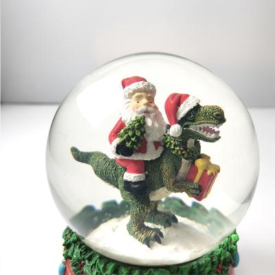 China Custom Resin Glass Water Snowball Logo Cute Santa Claus Dinosaur Christmas Gifts for sale