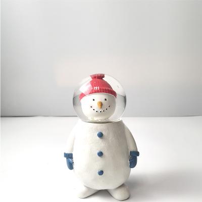 China Best Selling Cute Resin Glass Snowball Red Hat Christmas Snowman For Winter for sale